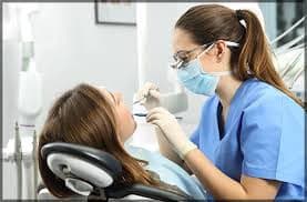 SMART Blog 5 Dental hygienist discussing care with a patient